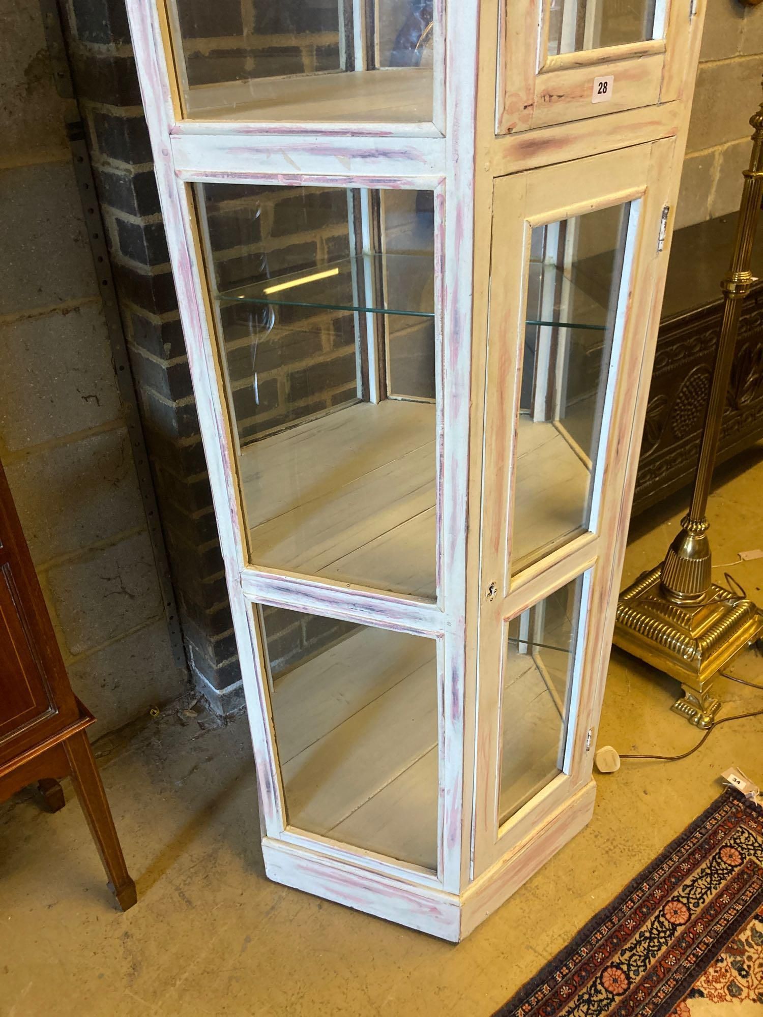 A modern white and pink marble effect painted display case, width 76cm height 181cm